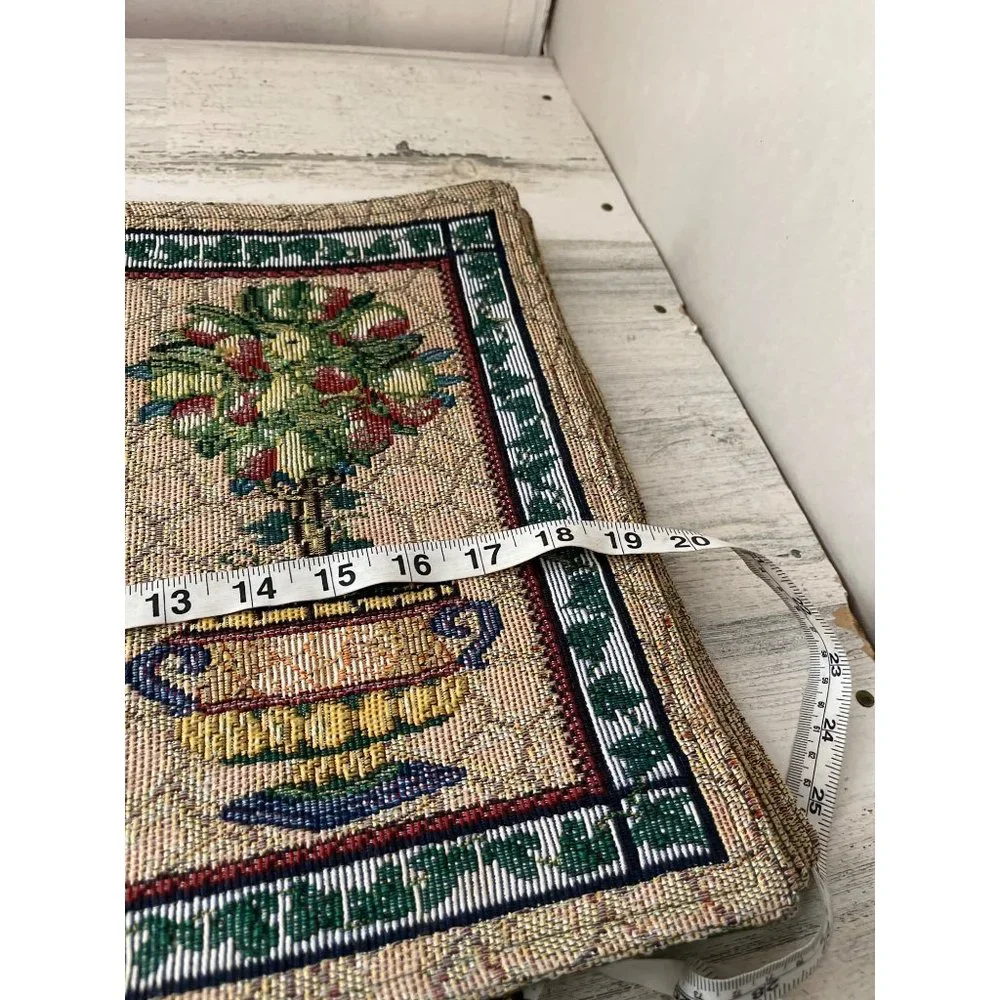 Set of eight cloth placemats with topiary designs